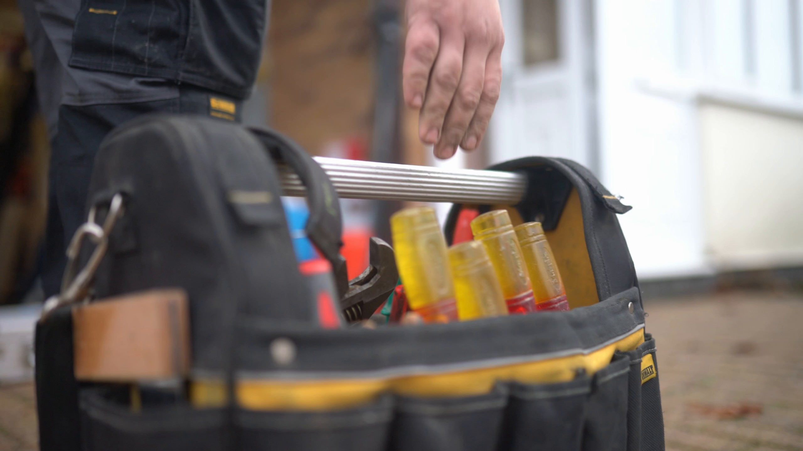 Plumber's tool bag full of screwdrivers